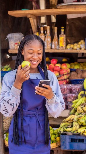 African market seller with a client, showcasing local trade - field validation interview still